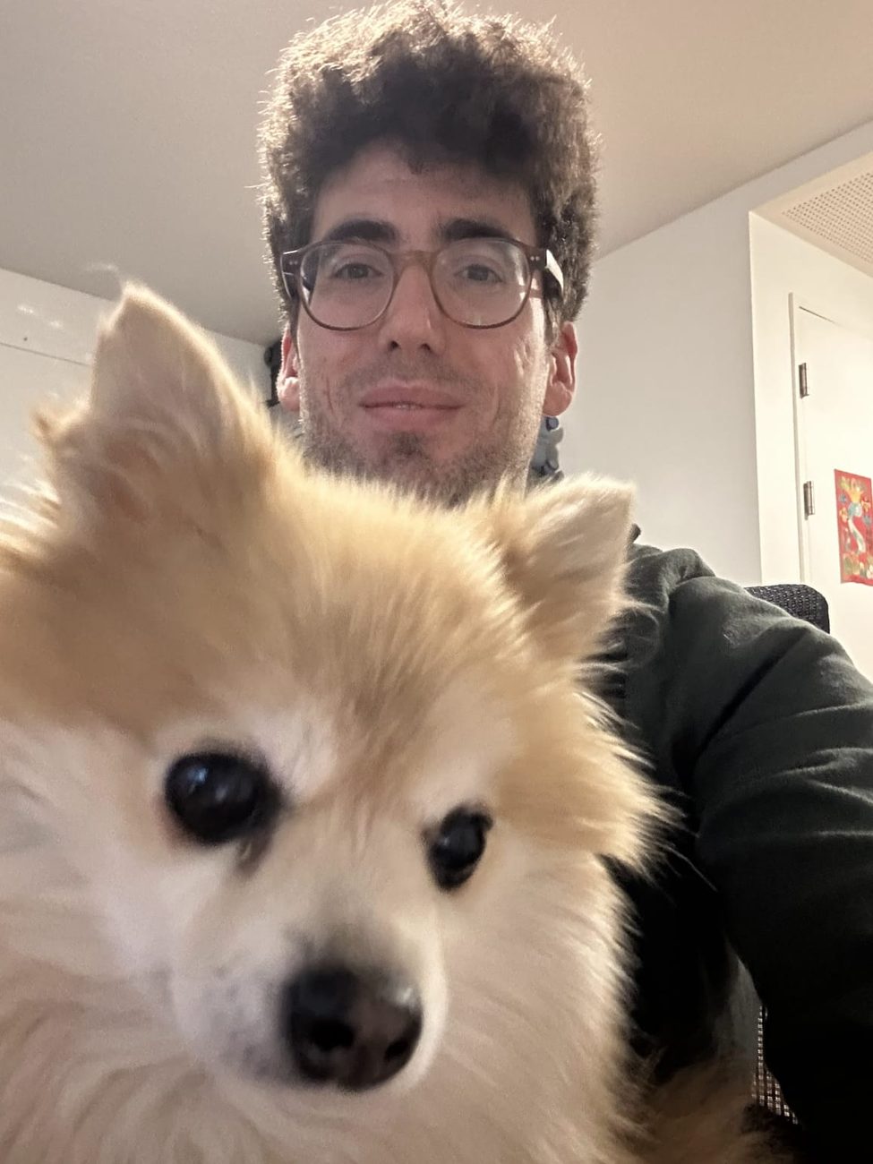 Smyrna the pomeranian posing for a selfie with Panos